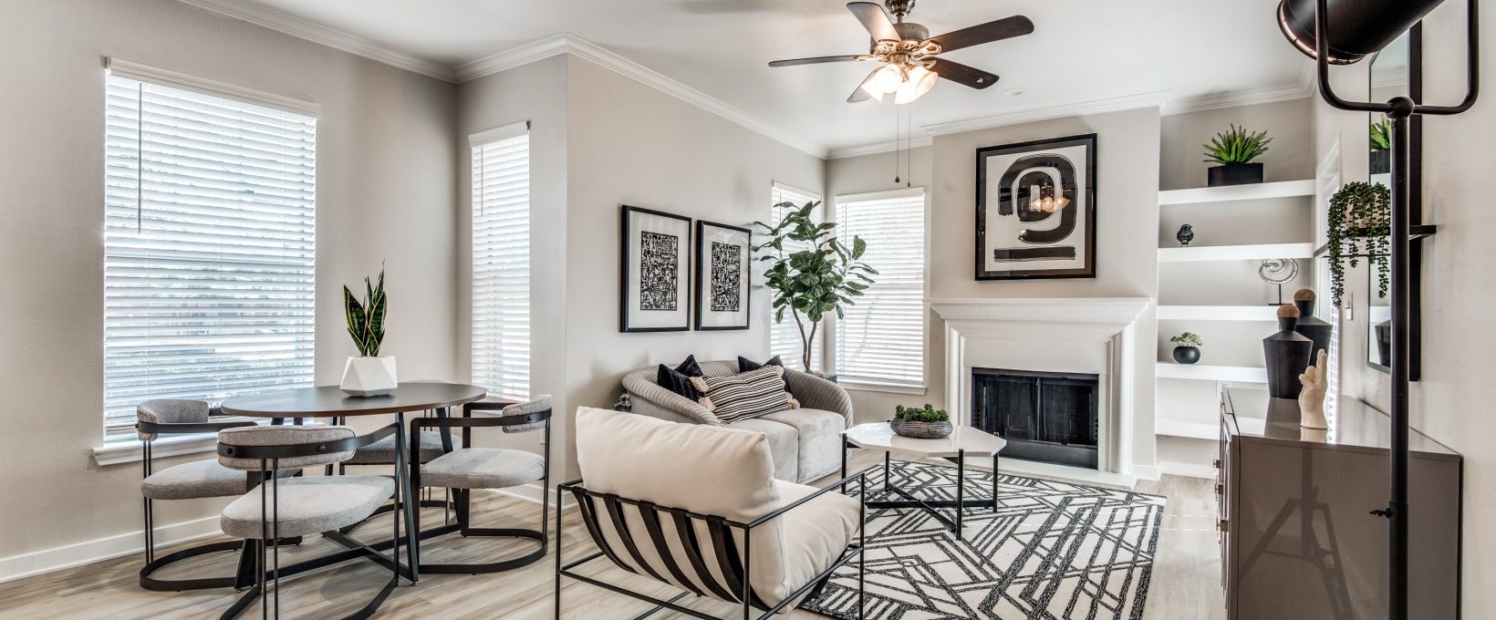 a living room with a ceiling fan and hardwood floors at The  Montgomery